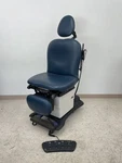 Pre-owned Midmark 630/75L Power Procedure Table Chair Navy Top. Fixed Price $4500.00.